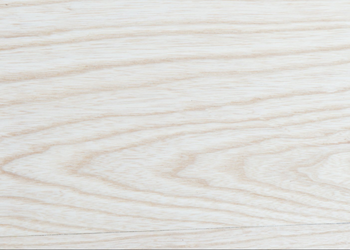 Ash wood grain displaying light cream color and prominent straight pattern for durable flooring and furniture